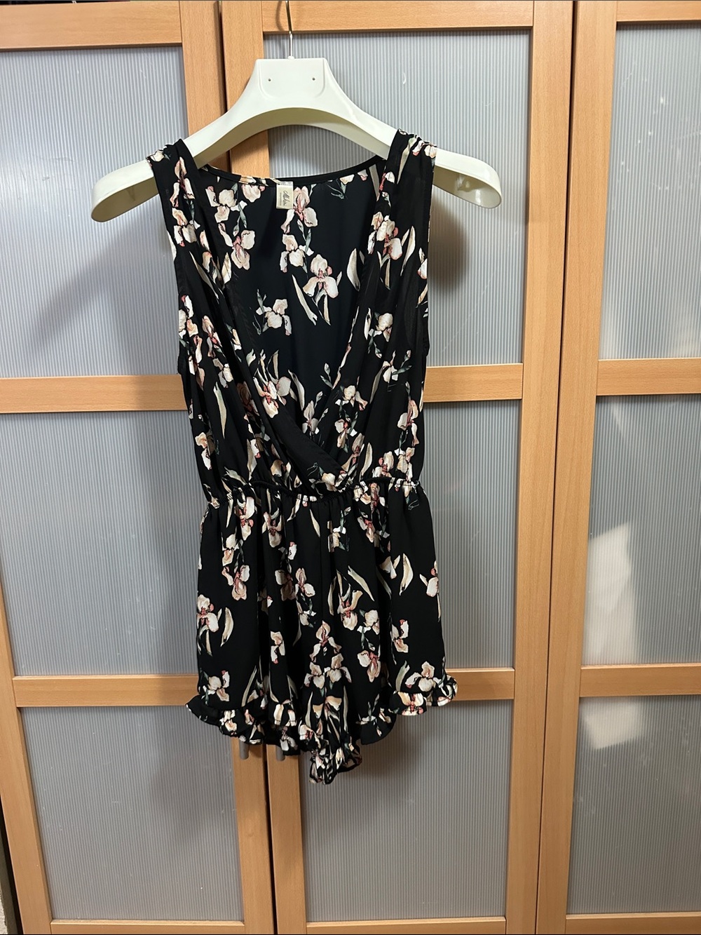 Mahina small Black Floral Sleeveless Romper w/Elastic Waist deep v front